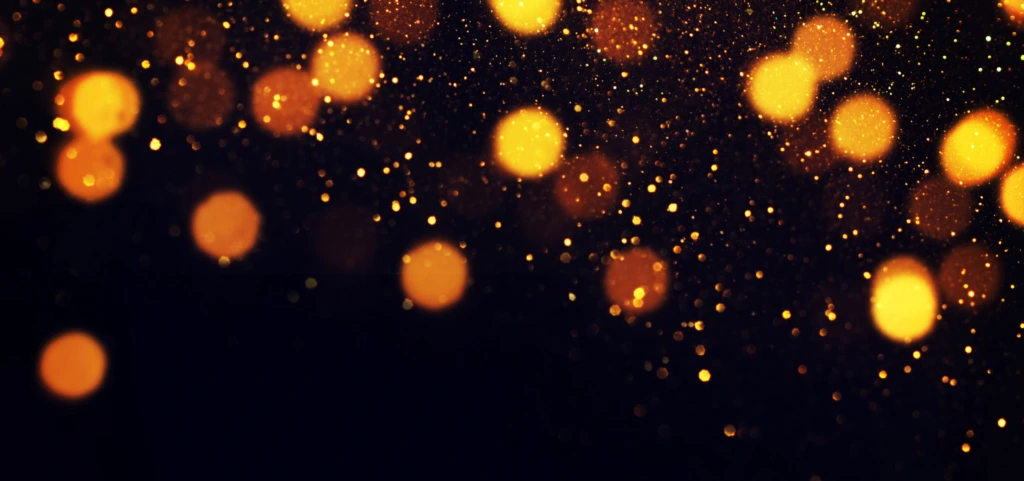 Bild för teaterns julkonsert. Foto av en ljusslinga i bakgrunden.